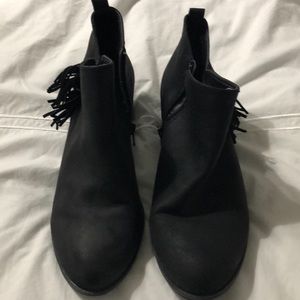 Black booties with tassels